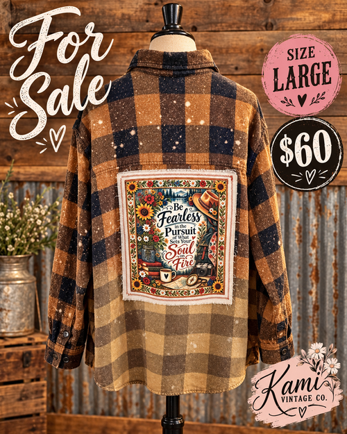Size Large mustard, brown, and black plaid flannel with a Be Fearless in the Pursuit of What Sets Your Soul on Fire floral adventure back panel.