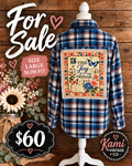 Large slim-fit blue plaid flannel with Find Joy in the Ordinary floral and butterfly vintage-postcard back panel.