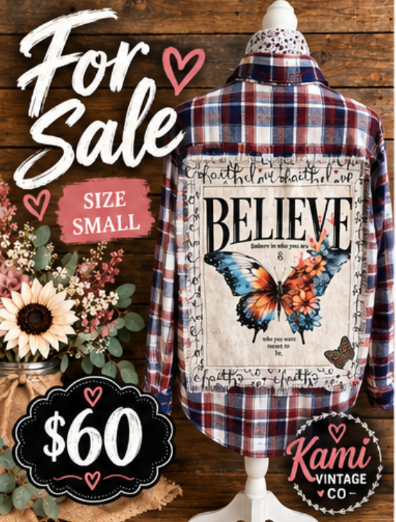 Size Small navy, burgundy and cream plaid flannel with Believe butterfly and floral back design, $60.